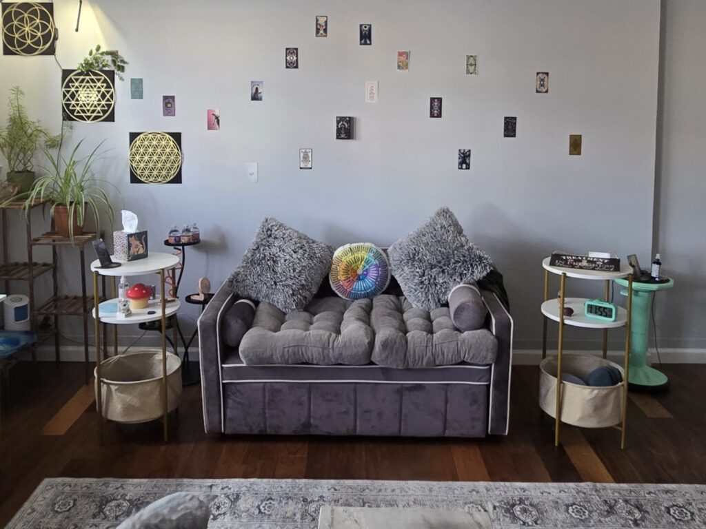 Cozy therapy couch with decorative wall and sensory toys